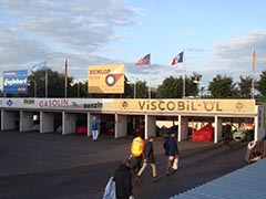 A selection of 1957 GP racing cars in the pits